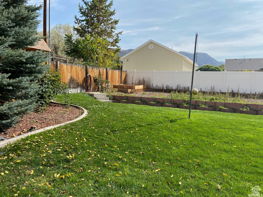 View of yard with a mountain view