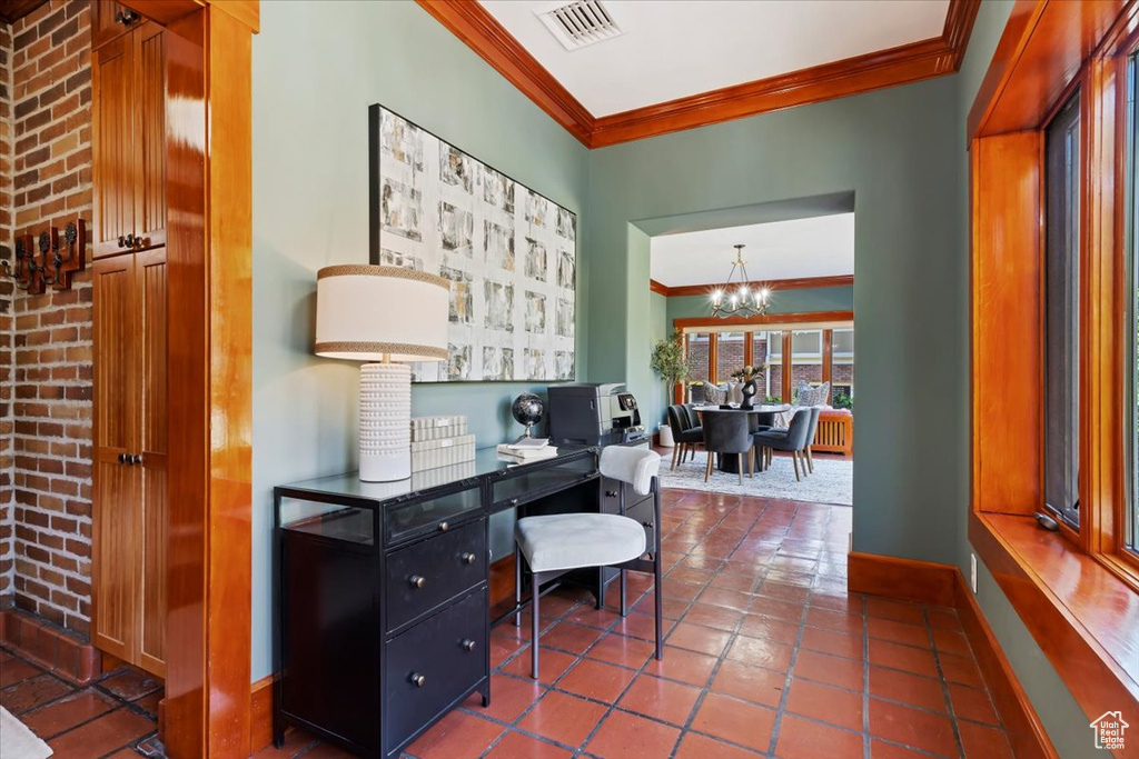 Home office with radiator, an inviting chandelier, and ornamental molding