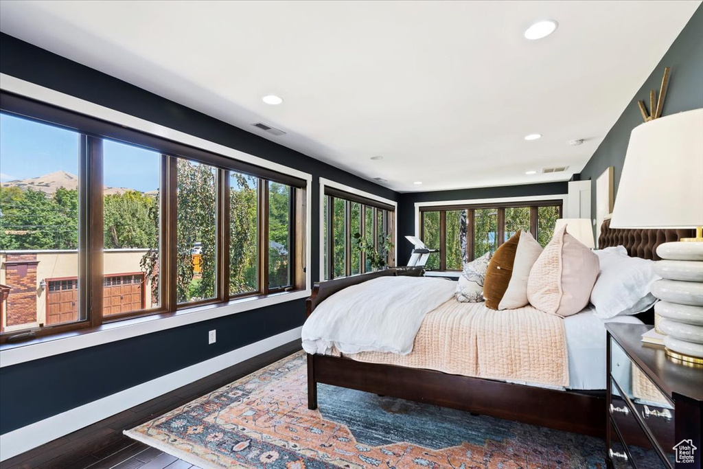 Bedroom featuring dark hardwood / wood-style flooring