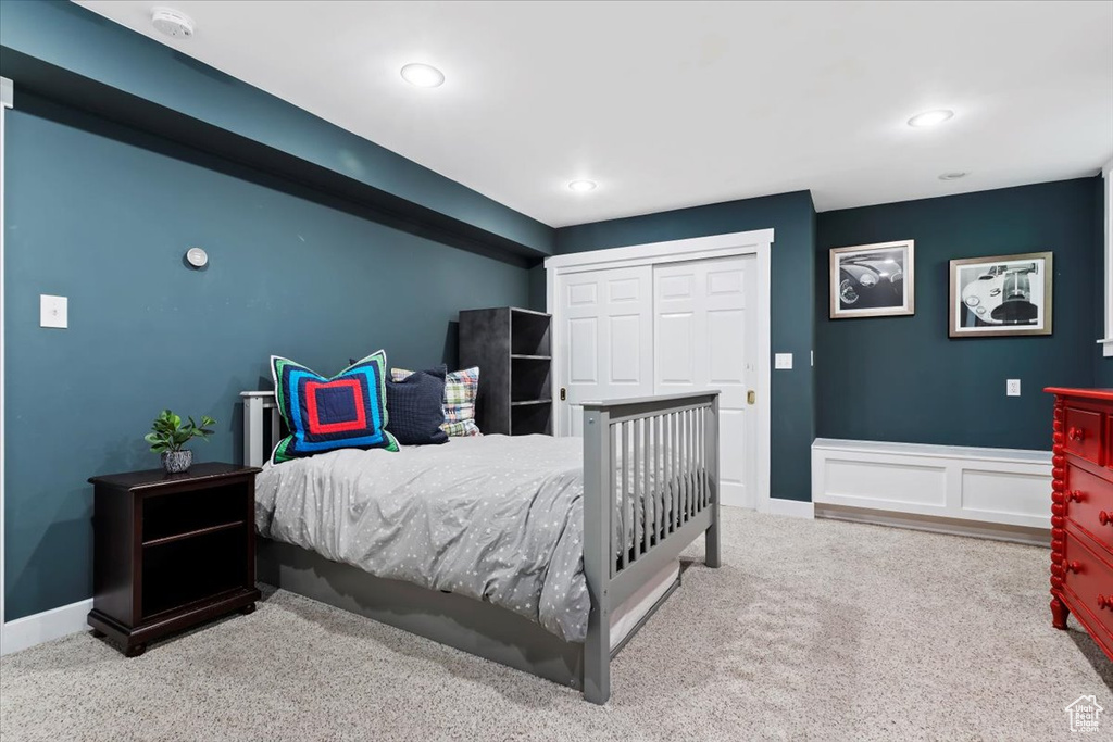 Bedroom featuring a closet and carpet flooring