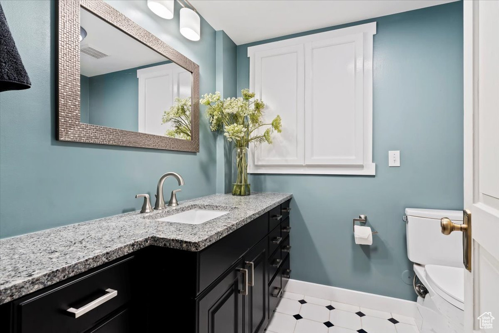 Bathroom with vanity and toilet