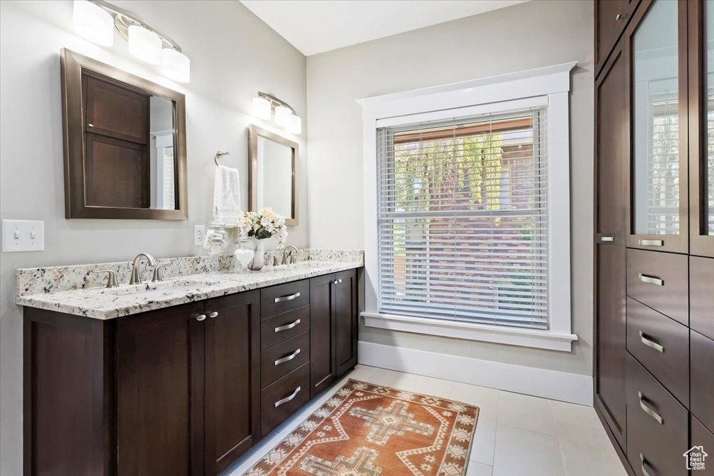 Bathroom with vanity and tile patterned floors