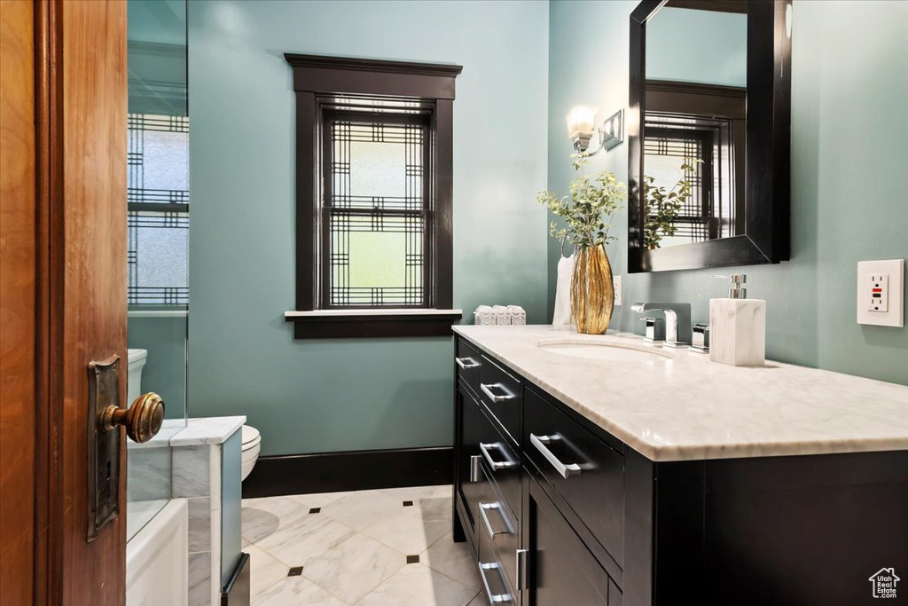 Bathroom with vanity and toilet