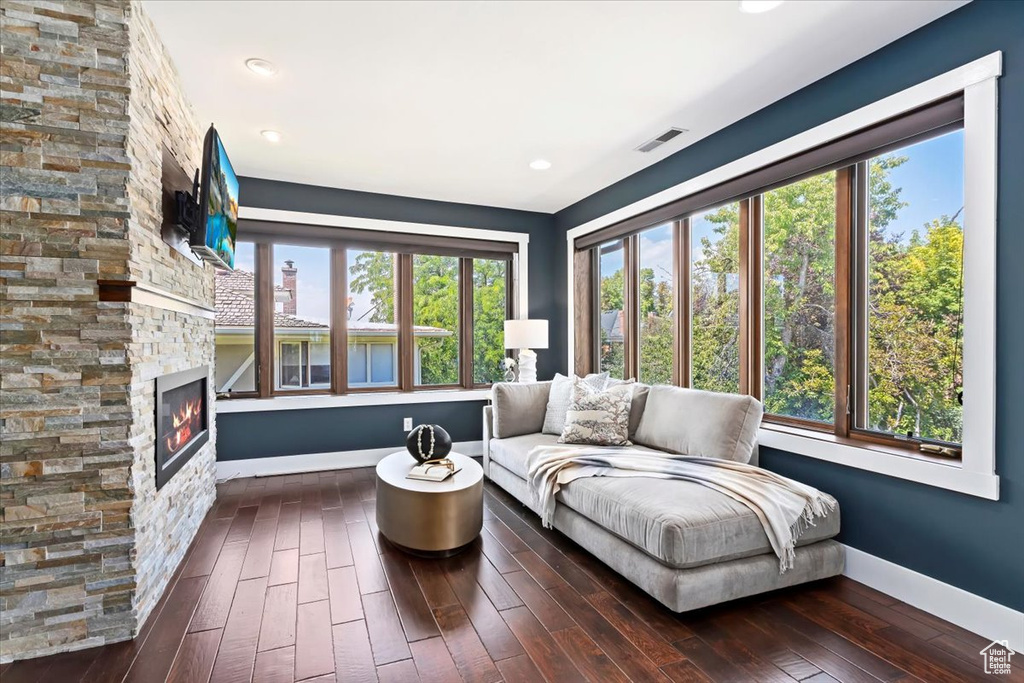 Interior space with a wealth of natural light and a stone fireplace