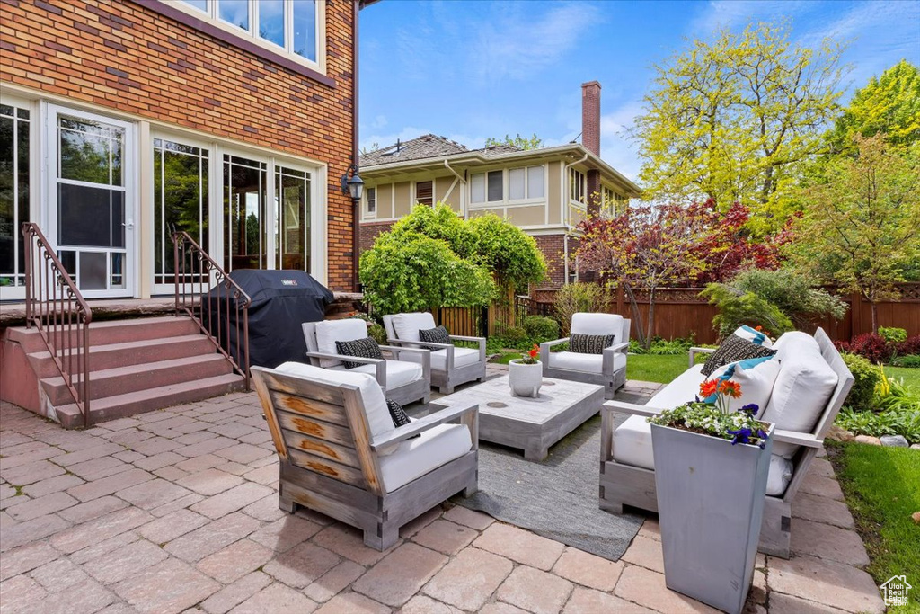 View of patio / terrace with an outdoor living space with a fire pit and area for grilling