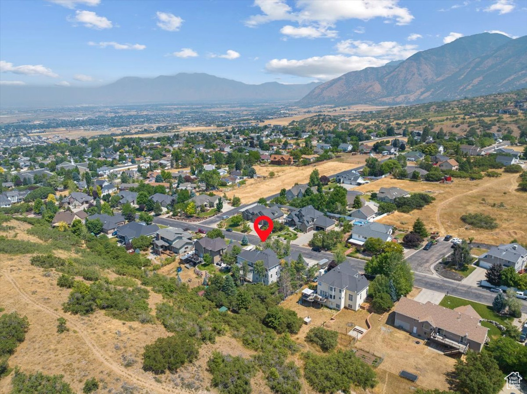 Birds eye view of property with a mountain view