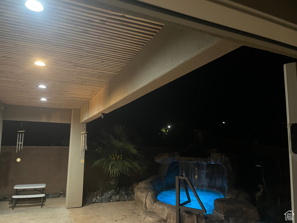 Pool at twilight with an outdoor pool and a patio area