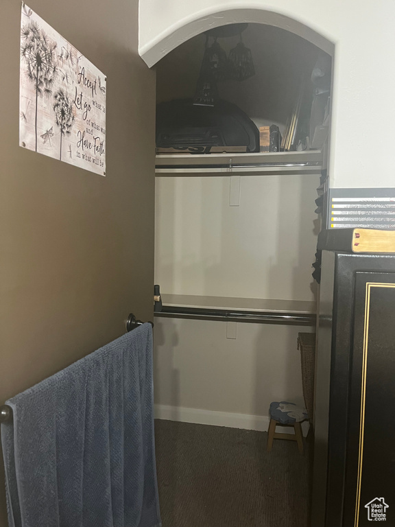 Interior space with baseboards and carpet