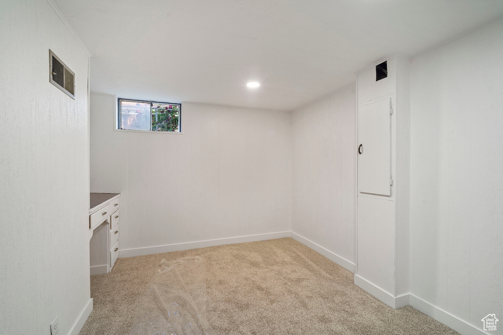 Unfurnished room with light colored carpet