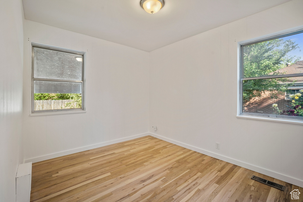 Spare room with light hardwood / wood-style floors