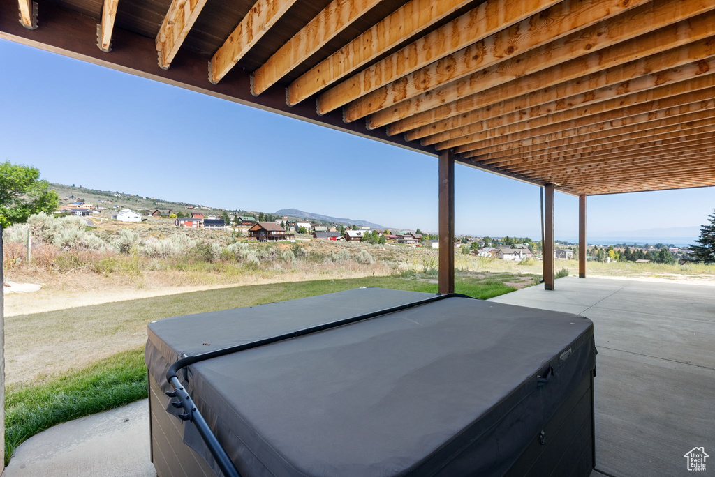 View of patio / terrace with a hot tub