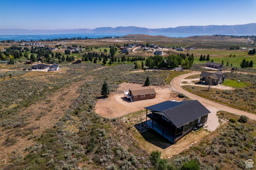 Birds eye view of property with a mountain view