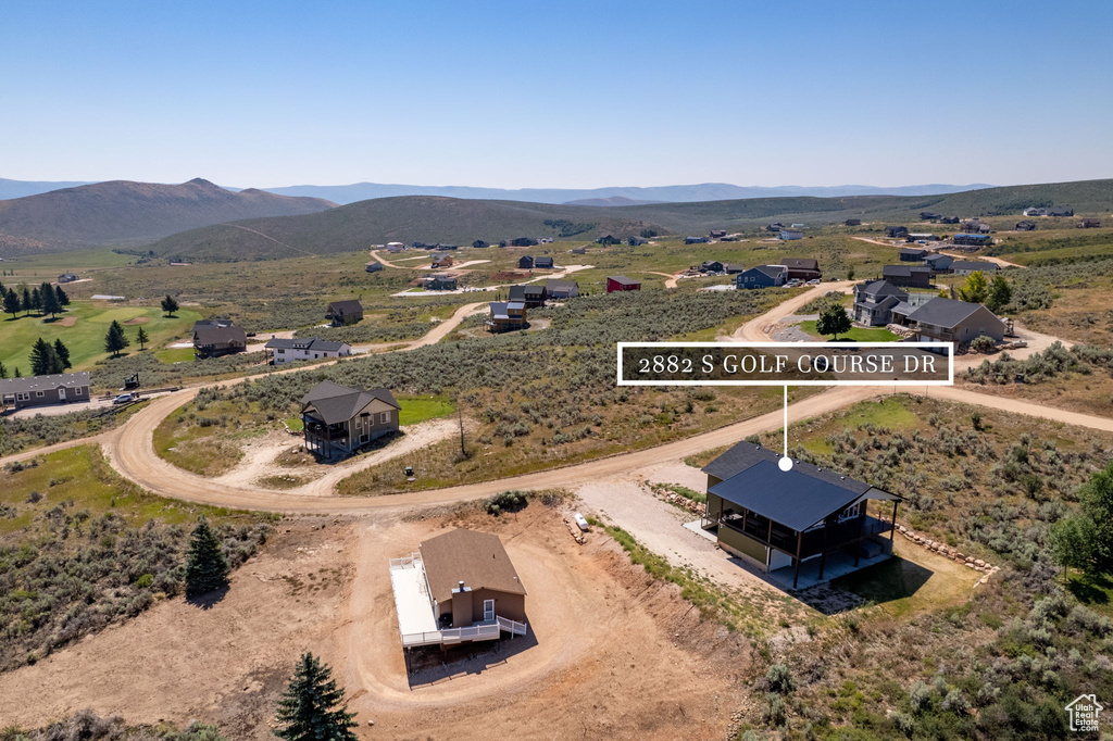 Birds eye view of property featuring a mountain view