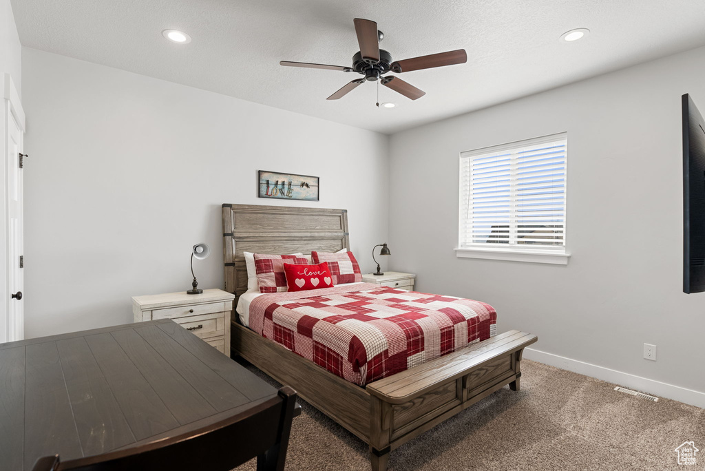 Bedroom with carpet and ceiling fan