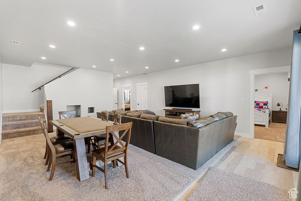 Living room with light wood-type flooring