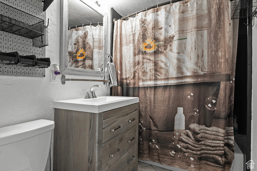 Bathroom with vanity and toilet