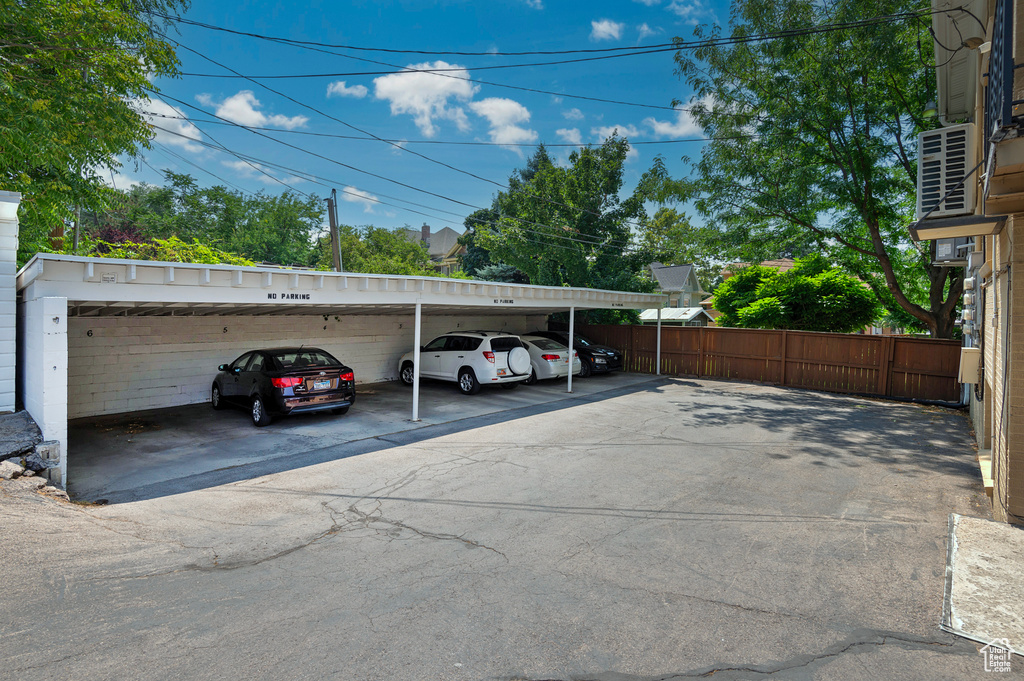 View of car parking featuring a carport