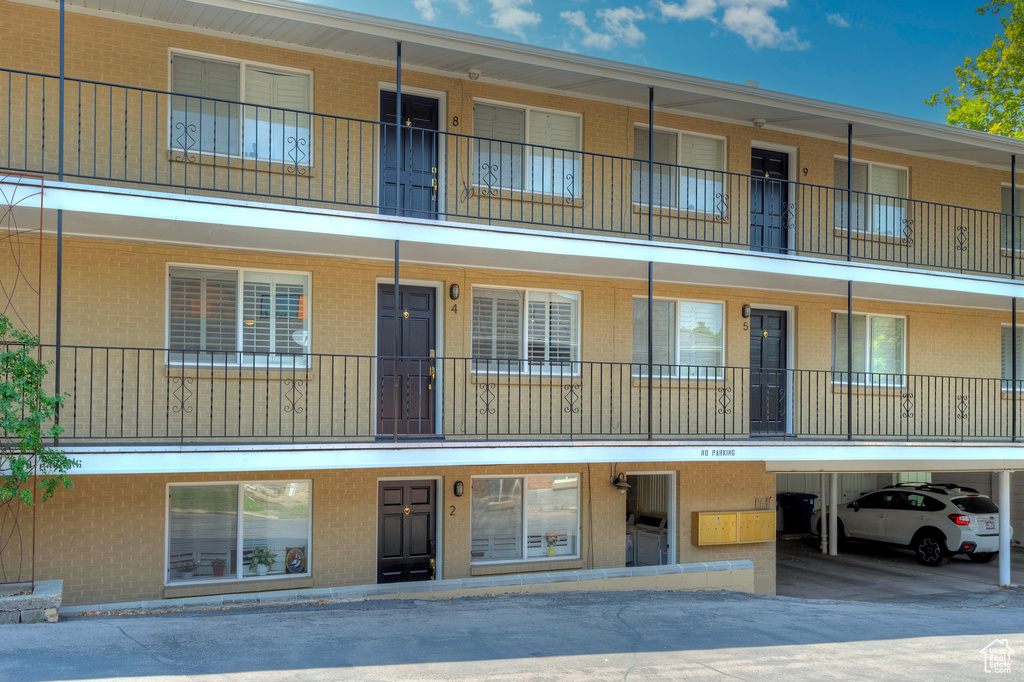 View of building exterior with a carport