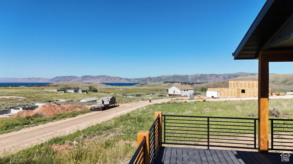 Wooden deck featuring a mountain view and a rural view