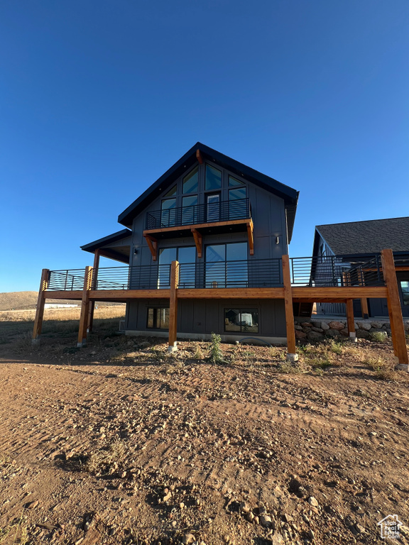 Back of house featuring a deck