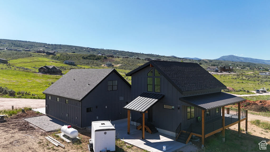 View of front of home featuring a mountain view