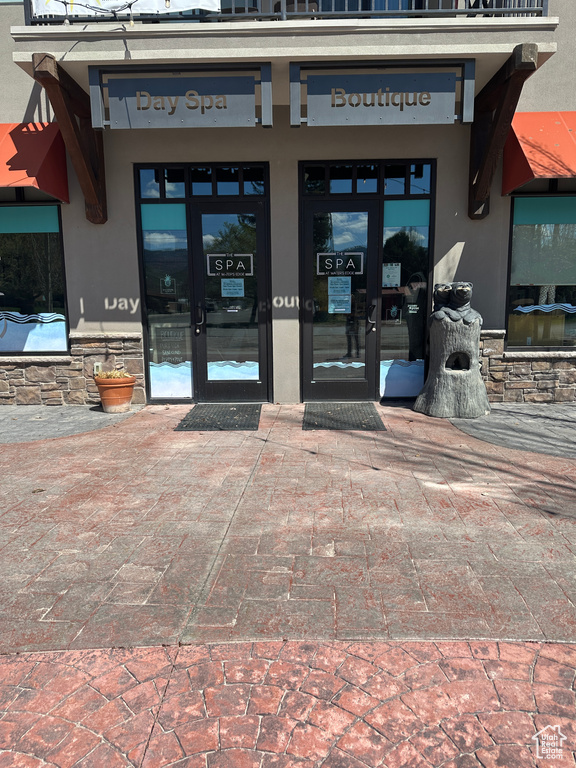 Entrance to property with french doors and stucco siding