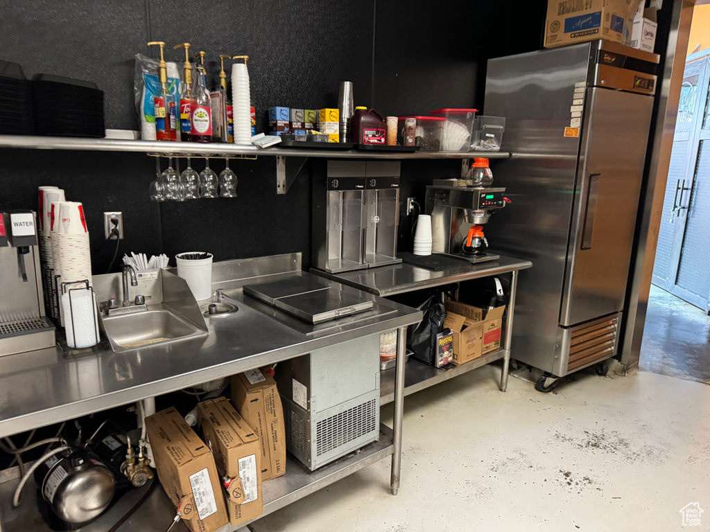 Bar featuring stainless steel refrigerator