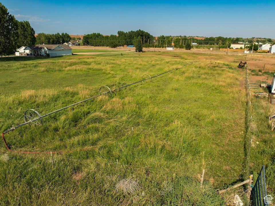 View of yard with a rural view