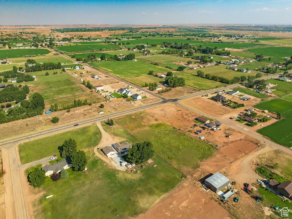 Birds eye view of property featuring a rural view