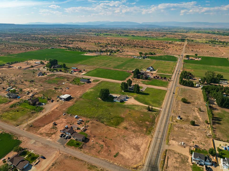 Birds eye view of property featuring a mountain view and a rural view