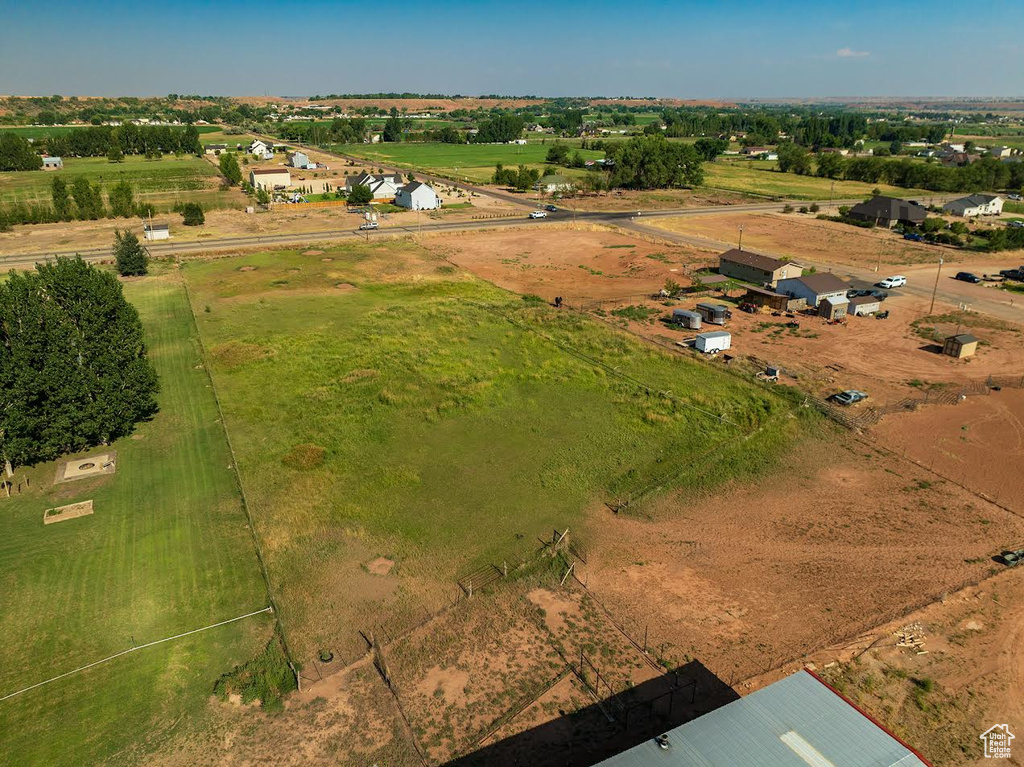 Birds eye view of property with a rural view