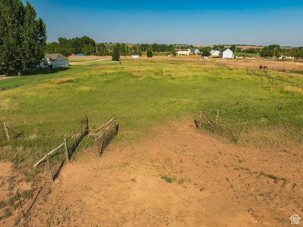 View of yard with a rural view