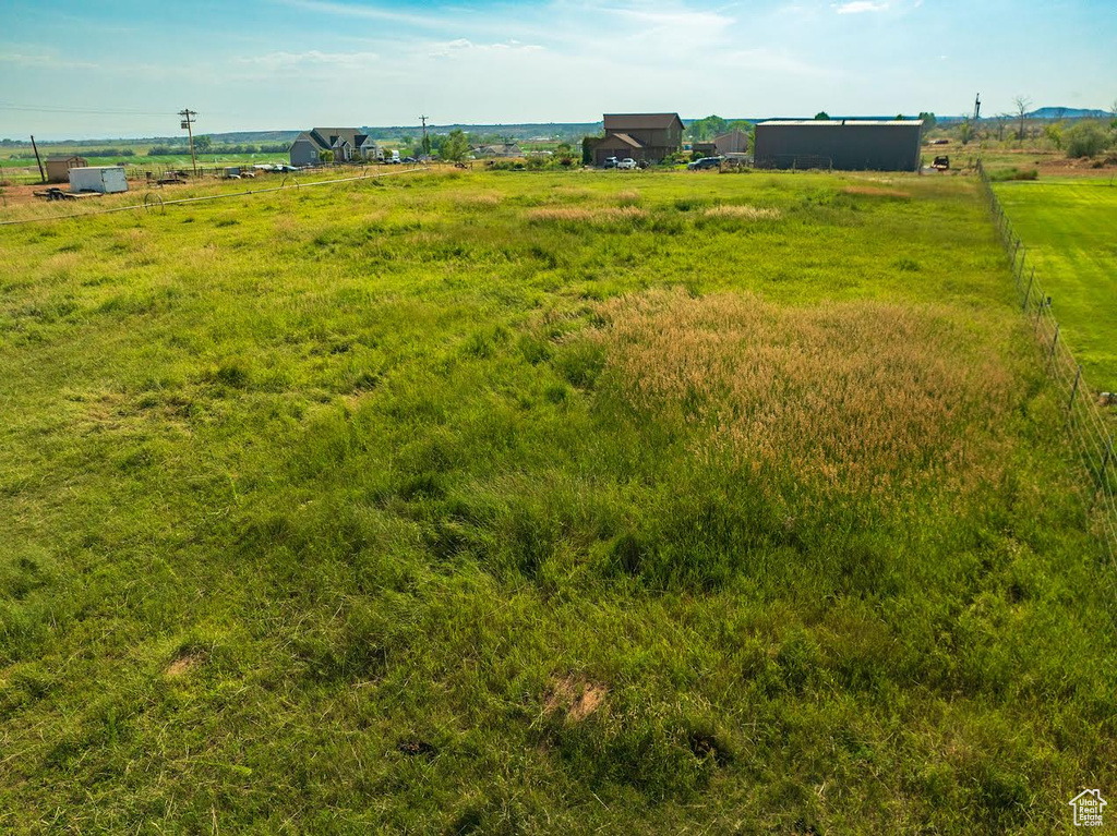 View of yard with a rural view