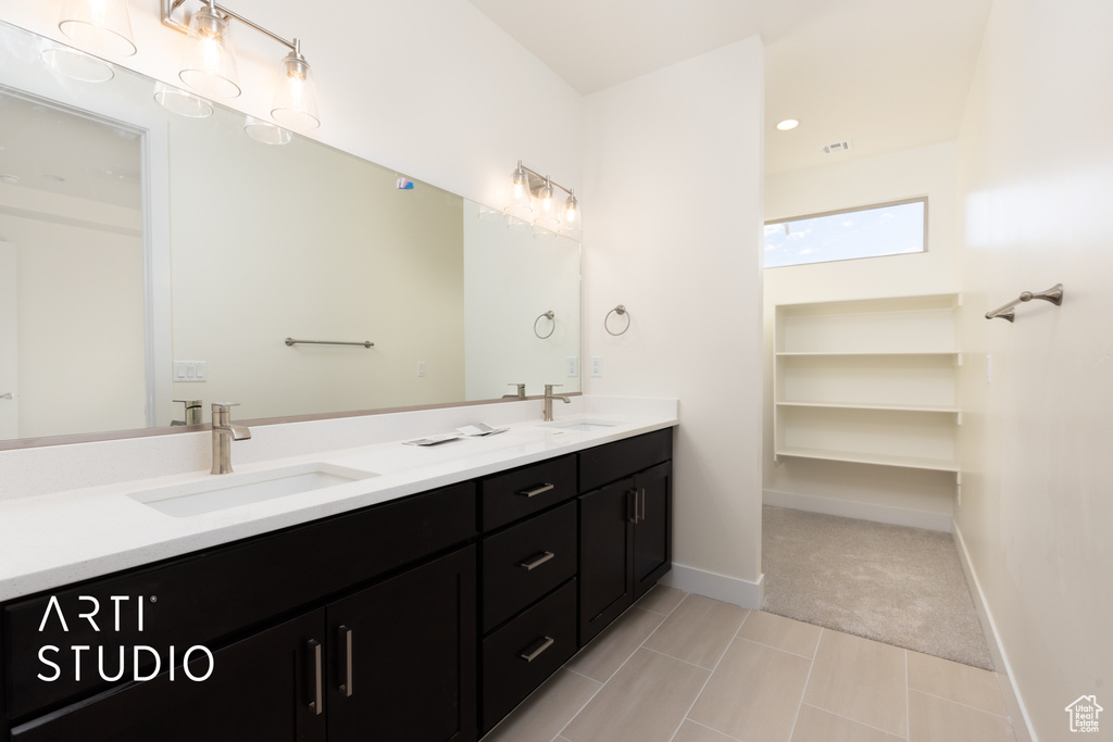 Bathroom with vanity and tile patterned flooring