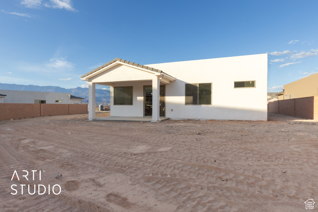 Back of property featuring a mountain view