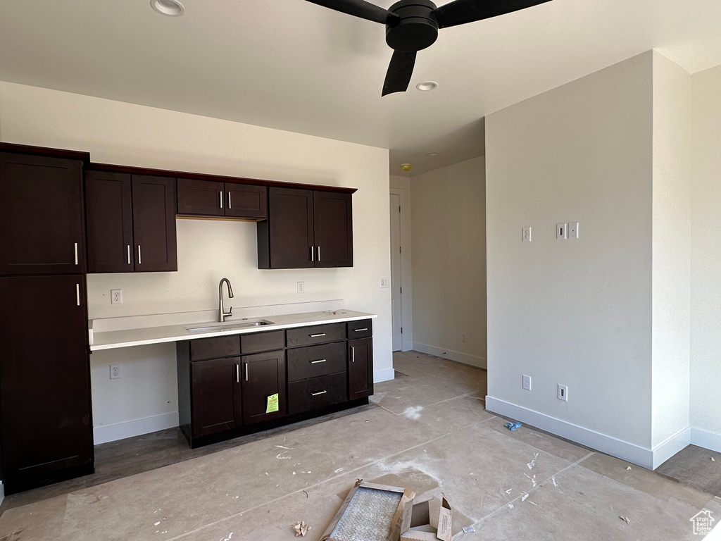 Kitchen with sink, ceiling fan, and dark brown cabinetry