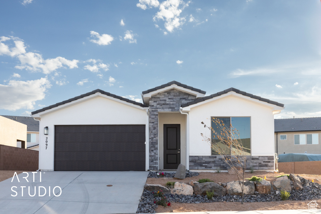 View of front of home with a garage