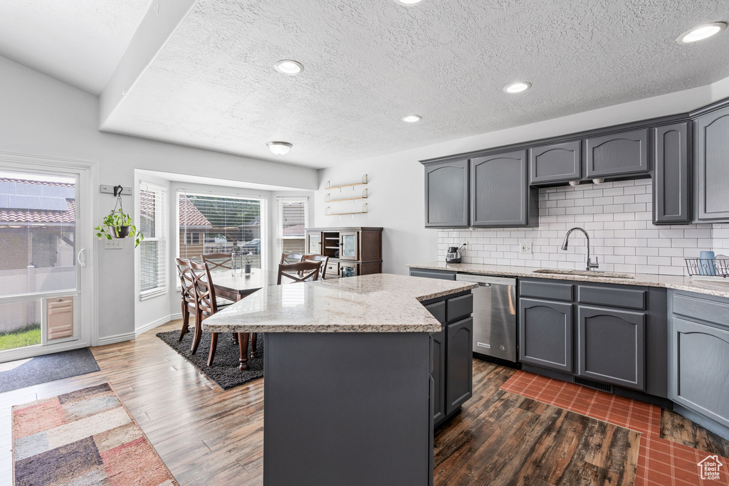 Kitchen featuring sink, dark hardwood / wood-style flooring, and gray cabinetry