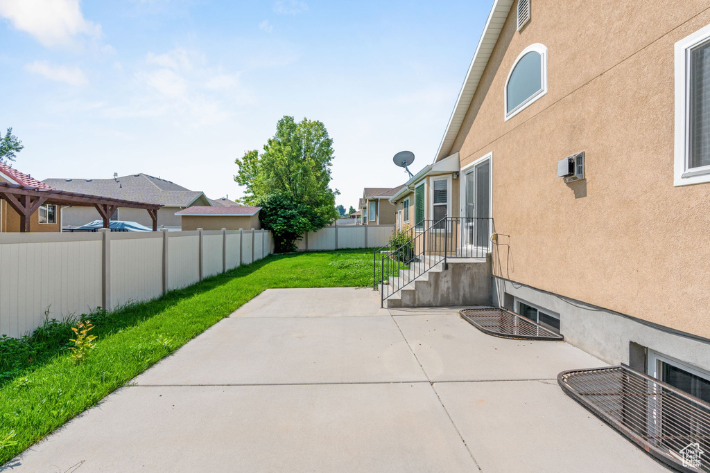 View of patio / terrace with a wall mounted AC