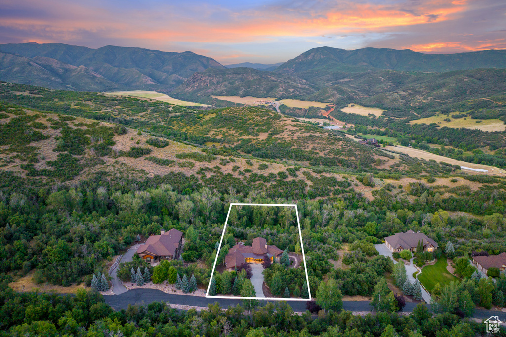 Aerial view at dusk featuring a mountain view