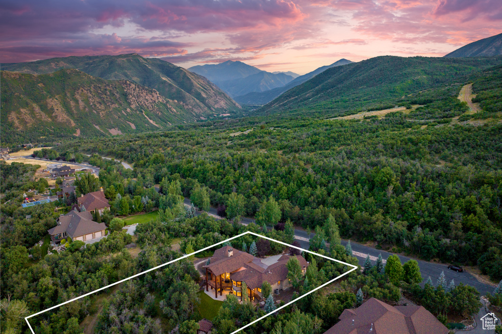 Aerial view at dusk featuring a mountain view