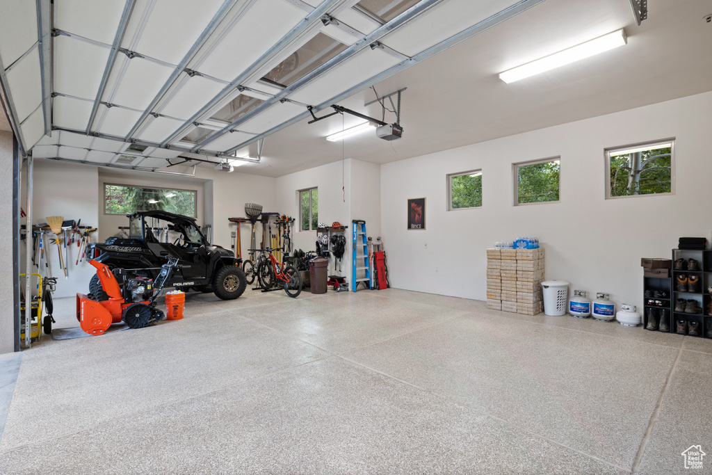 Garage featuring a garage door opener