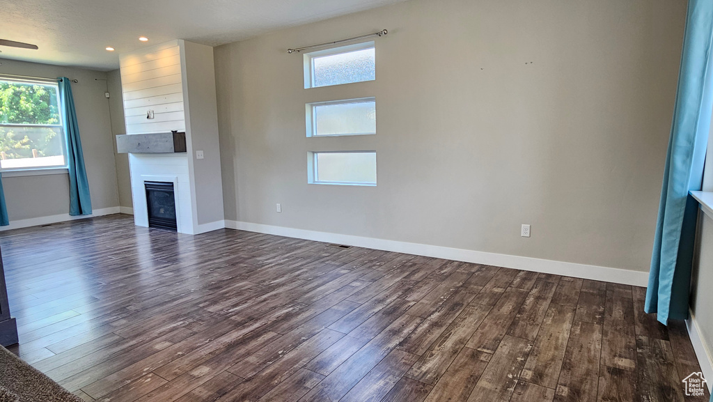 Unfurnished living room featuring hardwood / wood-style floors