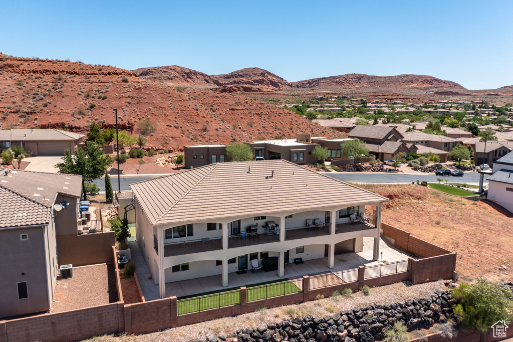 Birds eye view of property with a mountain view