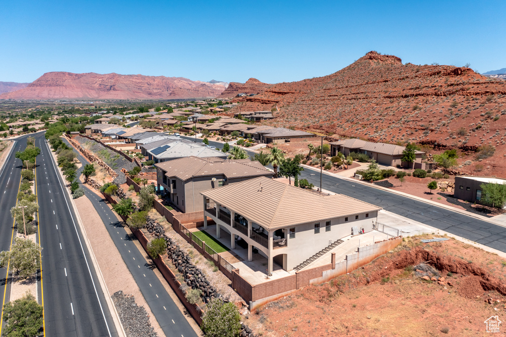 Birds eye view of property with a mountain view