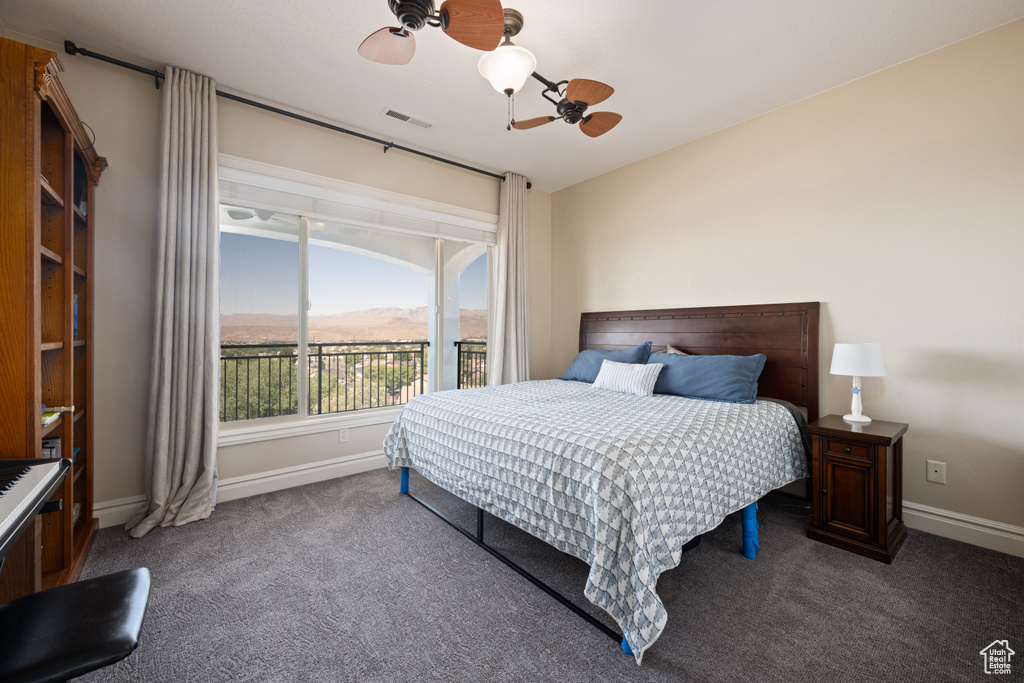 Bedroom featuring carpet and ceiling fan