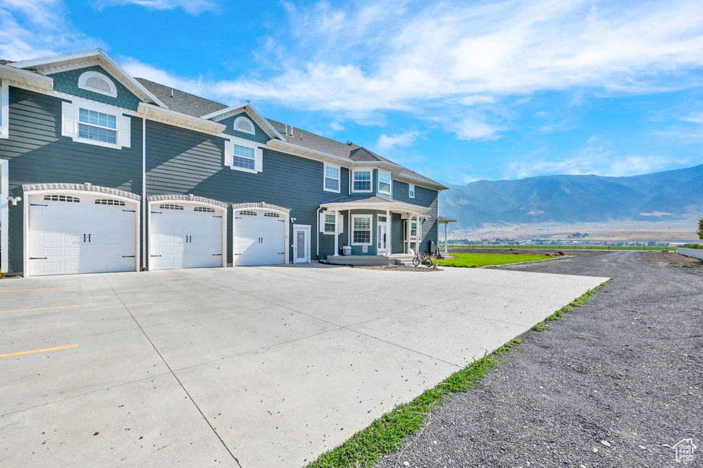 Exterior space with a mountain view and a garage