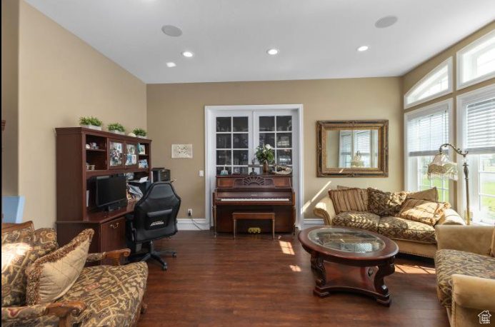 Living room with hardwood / wood-style flooring