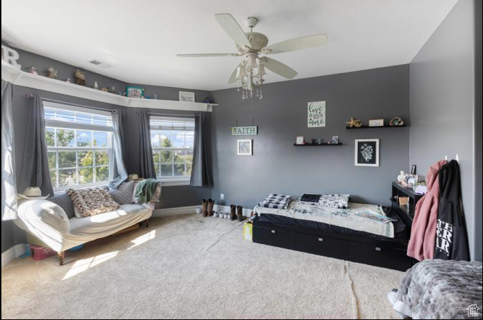 Bedroom with carpet flooring and ceiling fan