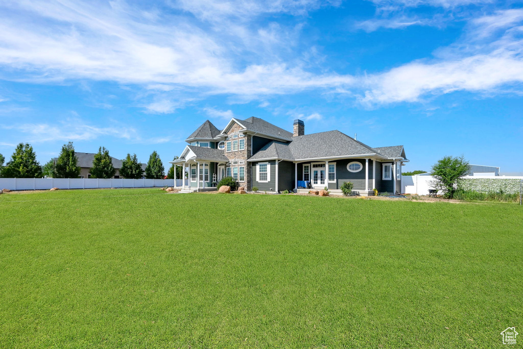 View of front of house with a front yard